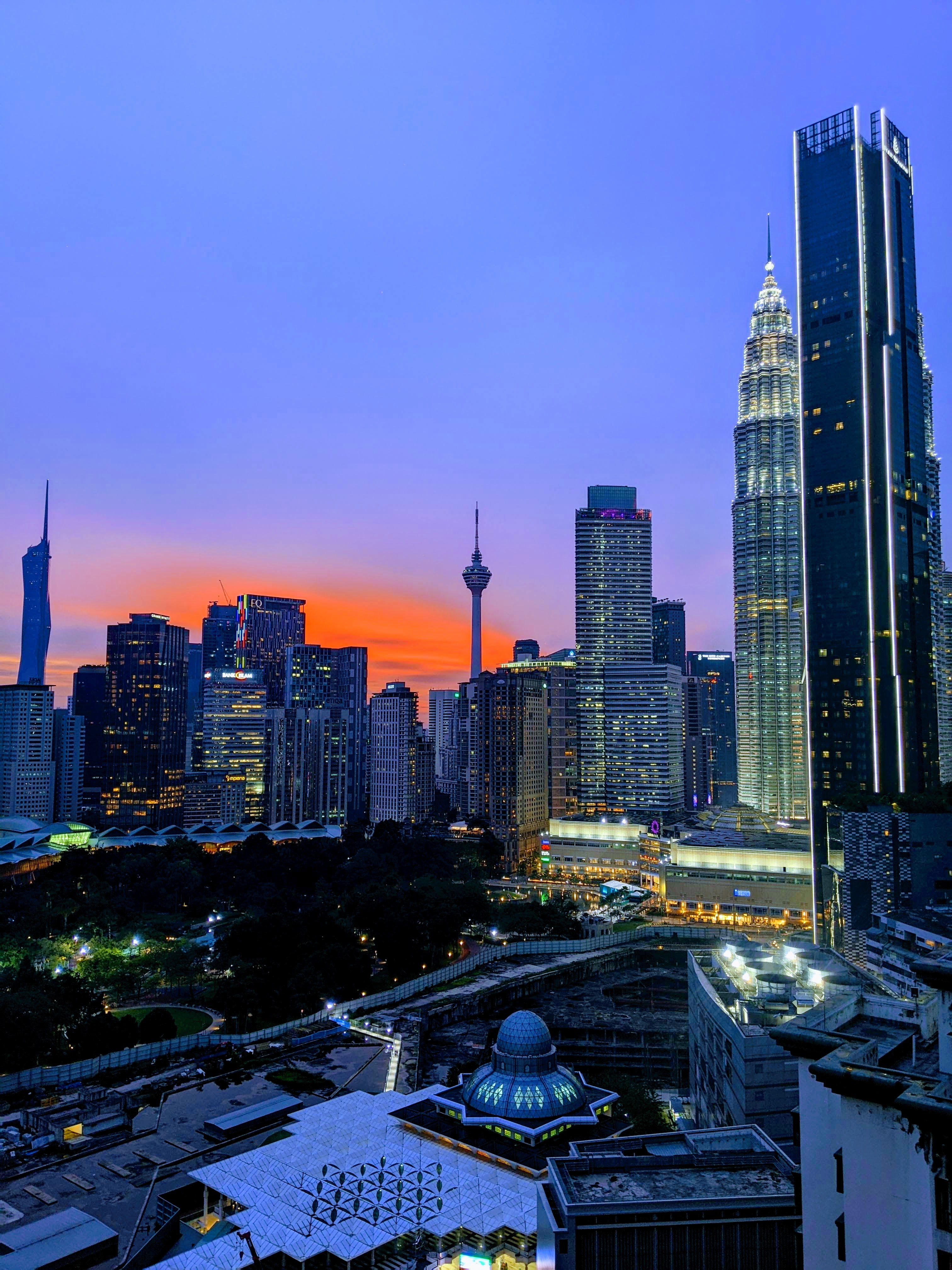 Kuala Lumpur skyline during sunset, with pink sky